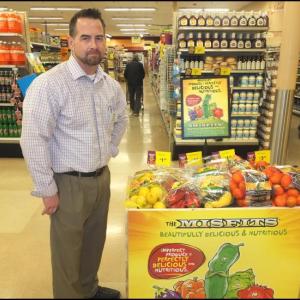 Brian Pellerin, assistant store manager at Hannaford’s Rockland stands beside a bin of Misfit vegetables. (Photos by Chris Wolf)