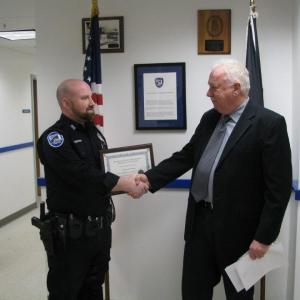 Rockland Police Chief Bruce Boucher (right) congratulates Officer Andrew Redden for being chosen as the department’s Police Officer and Employee of the Year for 2016. (Photo courtesy of the Rockland Police Department)