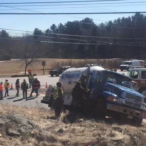 Cameron Henry tried to avoid hitting a pickup truck at the intersection of routes 1 and 90 today, and in doing so, landed in a precarious position. (Photo by Lynda Clancy)