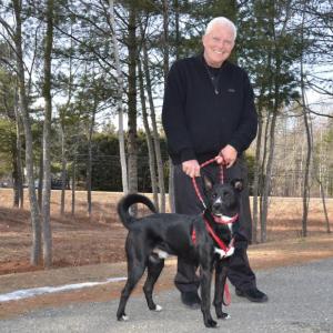 Charlie Morecraft with one of the dogs ready for adoption at P.A.W.S. in Camden. (Photo by Lynda Clancy)