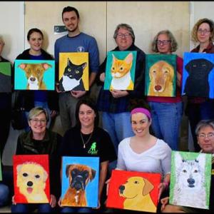 Participants display their finished portraits at Pope Memorial Animal Shelter in Thomaston.