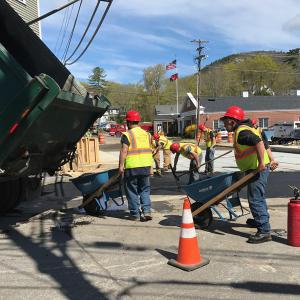 Laying pavement atop the newly reconstructed Bakery Bridge in Camden. (Photo by Holly S. Edwards)