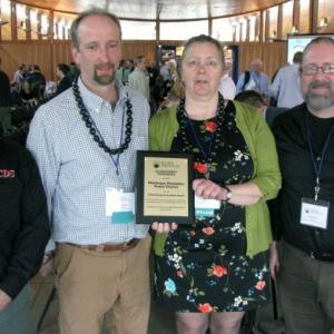 Marian Chioffi and Chris Smith of the Monhegan Plantation Power District (center) were joined by representatives of Innovative Construction & Design Solutions, LLC after receiving the Island Energy Innovation Award at the 2017 Island Energy Conference in South Portland on April 28. (Pictured L-R: Dan Fisher, ICDS; Chris Smith; Marian Chioffi; and Scott Fitch, ICDS)
