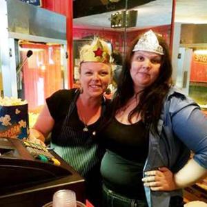 Amber Roberts and Kristy Jewell, employees of Colonial Theatre get into the superhero spirit.