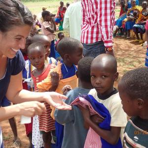 Michelle Bianchi, Founder/Director of the Michelle and Frederick Bianchi Education Foundation, with a group of school children in Kenya.
