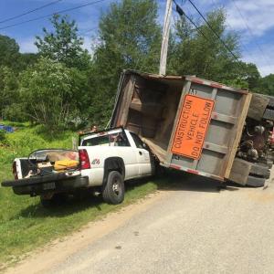 A dump truck rolled over and landed on top of the front end of a Chevrolet pickup truck on Vinal Street in Rockport July 11. (Photo courtesy of Rockport Fire Department)