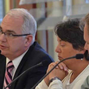 Attorney William Stockmeyer, of the Portland-based firm Drummond Woodsum, sits with School Administrative District 28 Superintendent Maria Libby and board Chairman Matt Dailey, July 13, in the Camden-Rockport Middle School cafeteria for a special meeting about the future of Mary E. Taylor school. (Photo by Lynda Clancy)