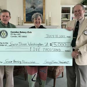 Sixty-Three Washington Street Board of Directors President Jeanne Denny accepted the grant from Richard Householder (left), who chairs the club's charitable grants committee, and Camden Rotary President Barry Timms.