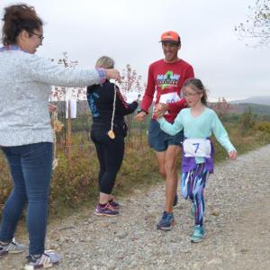 Runners and walkers took to the hills of Rockport Saturday morning, earning handmade medals for completing the first-ever Beach to Beech 5K up the new Connector Trail. (Photo by Lynda Clancy)