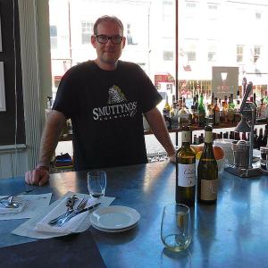 Chef and Owner Evan Mallett behind Ondine’s bar. (photo by Erica Thoms)