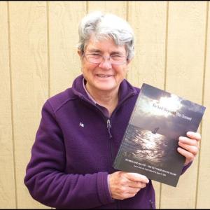 Susan St. John, of Owls Head, with her book, ‘To Sail Beyond the Sunset.’