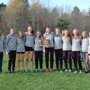 The Camden Hills girls cross country team with its state championship trophy. (Courtesy Steve Alex)
