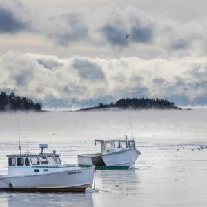 Mamosa and the Brenda Lee wait out the winter in Rockport Harbor. (Photo by Peter Ralston, Ralstongallery.com)