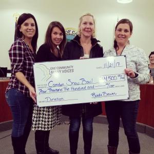 Members of One Community Many Voices and organizers of the Ragged Mountain Scuttle presented $4,500 to the Camden Snow Bowl on Nov. 21. Pictured, from left, are Kelly Woods and Audrey Lovering of OCMV and the Scuttle Committee, Diana Castle with the Scuttle Committee and Beth Ward with the Scuttle Committee and the Camden Snow Bowl.