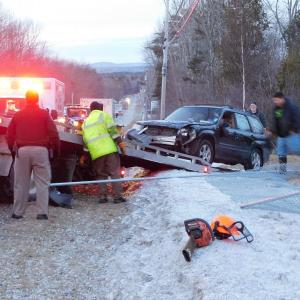 Dan’s Towing loads the 2003 Forester. (photo by Erica Thoms)