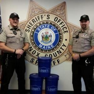Knox County Sheriff’s Office Deputies Tim Davis (left) and Paul Spear (right) are leading a “Sand for Seniors” program to help keep snow covered driveways and walkways clear for seniors who need special assistance. (Photo by Sarah Shepherd)