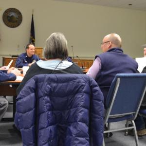 Members of the Rockland Harbor Management Commission talk with members of the U.S. Coast Guard. (Photo by Sarah Thompson)