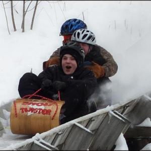 A toboggan crew takes a practice run down the chute.