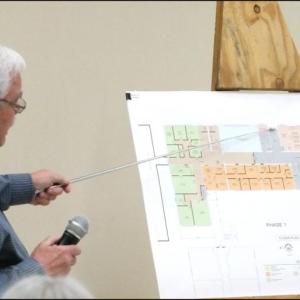 Architect John Hansen explains areas that would house municipal offices. gray areas would be public areas. Yellow would be town offices, orange police and blue the food pantry. The green area is the proposed phase two to house fire and EMS.