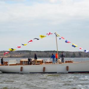 ‘Anna’, the 65-foot cold-molded sloop took her first dip in the St. George River April 2, to a cheering crowd. (Photo by Lynda Clancy)