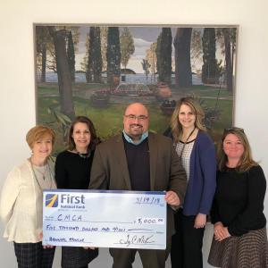 Gathered for a check presentation at CMCA are Susan Norton, EVP/Chief Administrative Officer at First National Bank; Suzette McAvoy, Director of CMCA; Jake Miller, VP/Senior Business Development and Corporate Sales Officer at First National Bank; Michelle Curtis, VP/Regional Manager at First National Bank; and Niki Janczura, Business Development Officer at First Advisors.