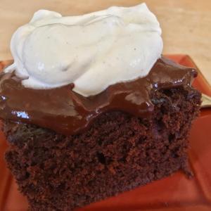 Warm chocolate olive oil cake with my notorious shiny dark chocolate boiled frosting, and a dollop of fresh whipped cream. SUZI THAYER/Boothbay Register