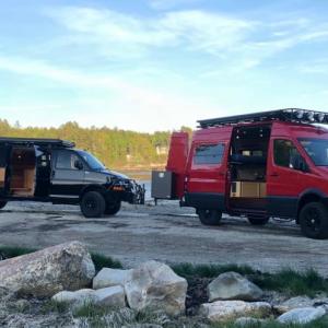 Jinx, a GMC van (left) and a Sprinter van both outfitted by AWOL Adventure Rigs. (Photo courtesy of Eli Ellis/ AWOL Adventure Rigs)