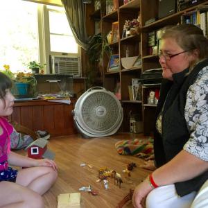 Kim Emerson plays horses with daughter Kandace, 6, in the Wiscasset living room of Emerson's parents Tammy and Mike Fiore Sept. 14. SUSAN JOHNS/Wiscasset Newspaper