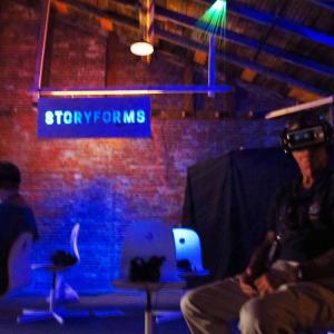 Participants sit under a monofilament installation by Rachel Lee Zheng with VR (virtual reality) headsets and earphones to interpret filmmaker stories. (Photos by Kay Stephens)