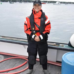 Marine Patrol Specialist Corrie Roberts Sports a new dry suit purchased with funds from the Maine Outdoor Heritage Fund. (Photo provided by Maine DMR)