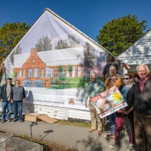 Members of the Rockport Library Foundation and community supporters unveiled a mural that depicts the new library at the site of the old and proposed future library, assuming voters approve Questions 2 and 3 this November.
L-R: Helen Shaw, Library Committee; Doug Cole, Select Board chairman; Ben Blackmon, librarian; Brian Filley and Ann Filley, Library Committee; Bill Leone, Capital Campaign Co-Chairman; Ben Odgren, Youth Services Librarian; Brandy Hare, Public Works Administrative Assistant; and John Viehman, Capital Campaign Committee. (Photo courtesy Rockport Library Foundation)