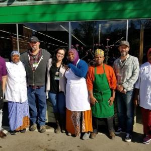 The staff of Belfast Co-op poses with members of Isuken Co-op Food Truck. (Photo courtesy Belfast Co-op)