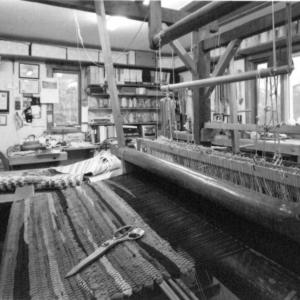 The beater on our old loom gleams from the touch of many hands.
Photo by Tillman Crane loom