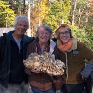 Norm Walters and Liz Hand show off the maitake - Hen of the Woods — mushroom they found, Diane O’Brien in middle. (Photo courtesy Don French) mushroom