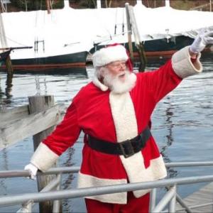 Santa arrives in Camden by boat, at the annual Christmas by the Sea celebration. (Photo by Chris Wolf)