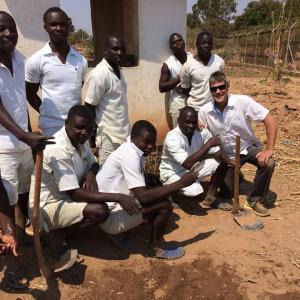 Rockland resident Scott Tilton, Peace Corps Volunteer, poses with Malawi villagers. (Photo courtesy of Peace Corps)