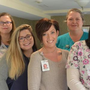 The newly certified group includes, from left, Iris Perkins-Powell, Savannah Tinker-Wadsworth, Mercedes Tremblay, Karyn Willis, and Andrea Annis (not shown: Jennifer Sanderson and Katlyn Grubbs). (Photo courtesy of Quarry Hill)