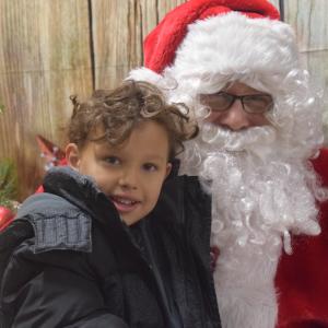 Legare Cuyler sits with Santa Clause during a school children’s shopping trip. (Photo courtesy of Thomaston Grammar School)