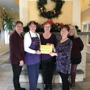 Present for the donation, given in the form of Hannaford gift cards, were (left to right) Heidi McCaffrey, VP of Hospice at Sussman House; Leigh Smith, Sussman House Volunteer and founder of ‘Ringing in the Season’; Joy Chamberlin, Volunteer Coordinator, Maine HealthCare At Home; Amy Rollins, ‘Ringing in the Season’ concert organizer; and Betsy Boynton, R.N.-CHPN, Sussman House Manager. (Photo courtesy of Ringing in the Season)