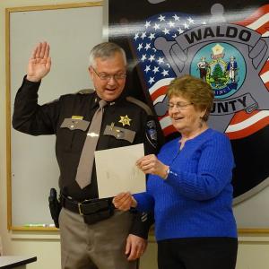 Sheriff Jeffrey Trafton is sworn-in for his second term as sheriff with Irene Blood, who worked with District Court for 30 years before retiring. (photo by Erica Thoms)