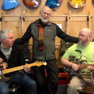 Mac Economy, Jack Churchill and Harvey Curtis with the guitars on display at K2 Music. (Photos by Chris Wolf)