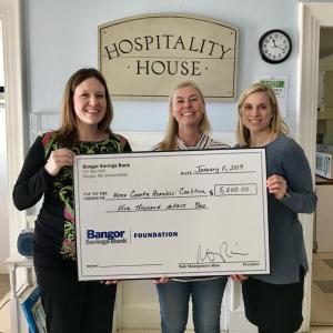 Left to right: Becca Gildred, Knox County Homeless Coalition Director of Development, Corey Belcher, Branch Manager, Bangor Savings Bank, Danielle Ahern, Bangor Savings Bank Foundation. (Photo courtesy of Knox County Homeless Coalition)