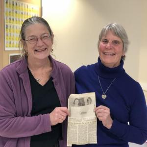 Ingrid Van Steenberg and Sybil Davis pose for a photo with the article of the opening of the original shelter (where they posed) Before and After! (Photo courtesy of Pope Memorial Humane Society)
