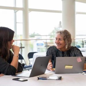 Outgoing Executive Director, Martha Piscuskas (right), and Director of Programming & Outreach, Meg Fournier (left), at the 2018 Maine International Conference on the Arts. Photo by Kyle Dubay. (Photo courtesy of the Maine Arts Commission)