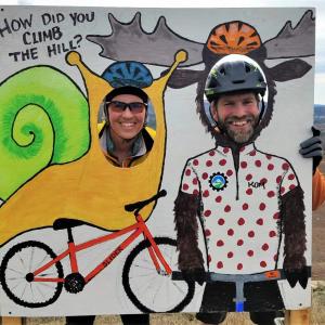 Safety crew volunteers Meredith Currier and Darby Urey stop at a photo booth at the top of a ridge. (Photo courtesy Stacey Keefer)
