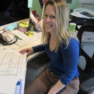 Tiffany Ford looks over building plans at her office in Rockport on April 26. (Photo by Louis Bettcher)