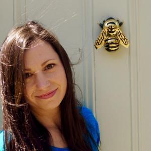 Amanda Amoroso in front of her studio door and its bee knocker. (Courtesy Amanda Amoroso)