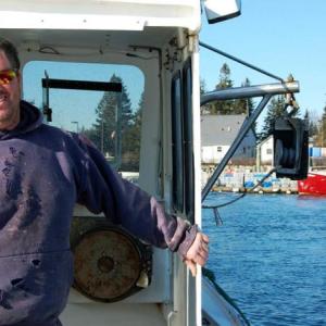Robert Young on his lobster boat in Vinalhaven Harbor. (Photo by Kristie Young)