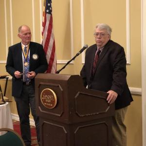 Outgoing Rockland Rotary President Fred Newcomb listens to remarks from Community Person of the Year Brian Harden.