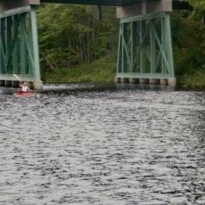 Kayakers pass beneath the Route 1 bridge on Nequasset Lake at last year’s Nequasset Paddle. File photo
